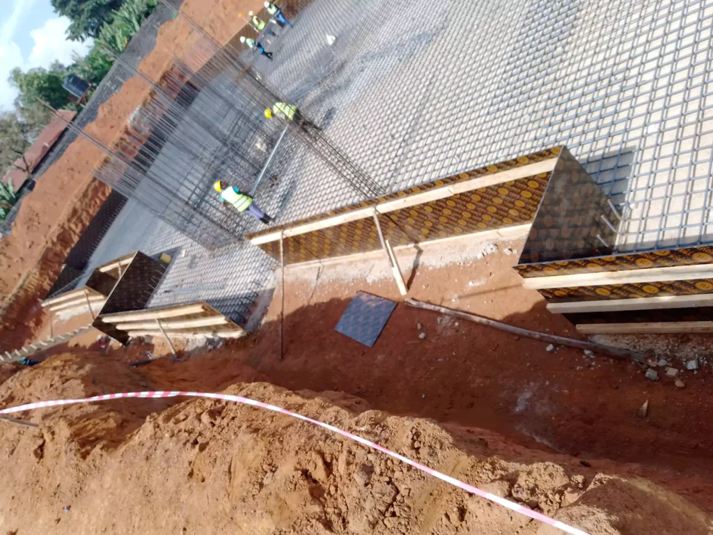 Formwork for a storey building. Marine boards reinforced with pine wood frames used to create formwork for a raft foundation.